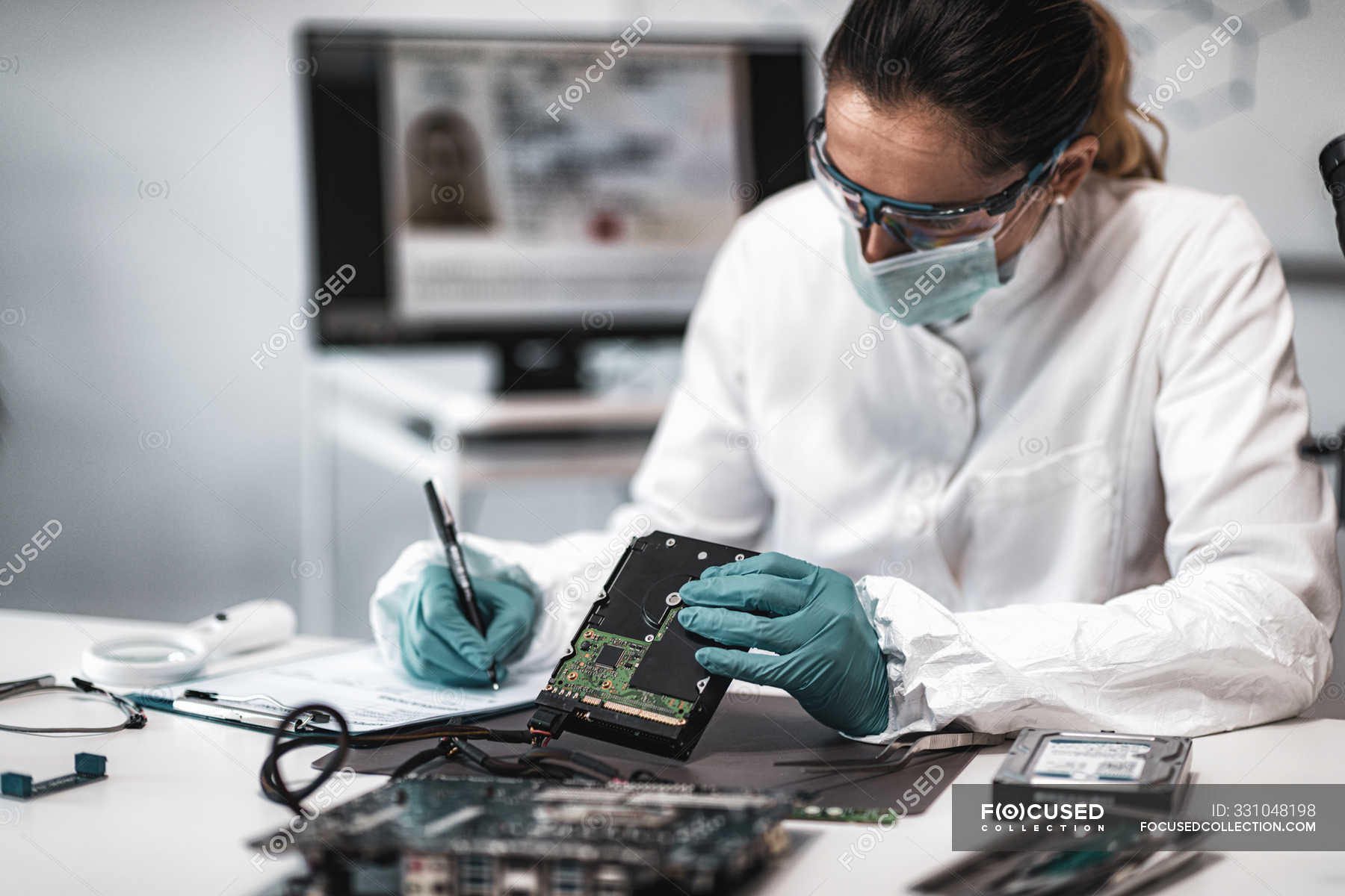 pic Image Forensic Expert https focusedcollection com 331048198 stock photo female digital forensic expert examining html