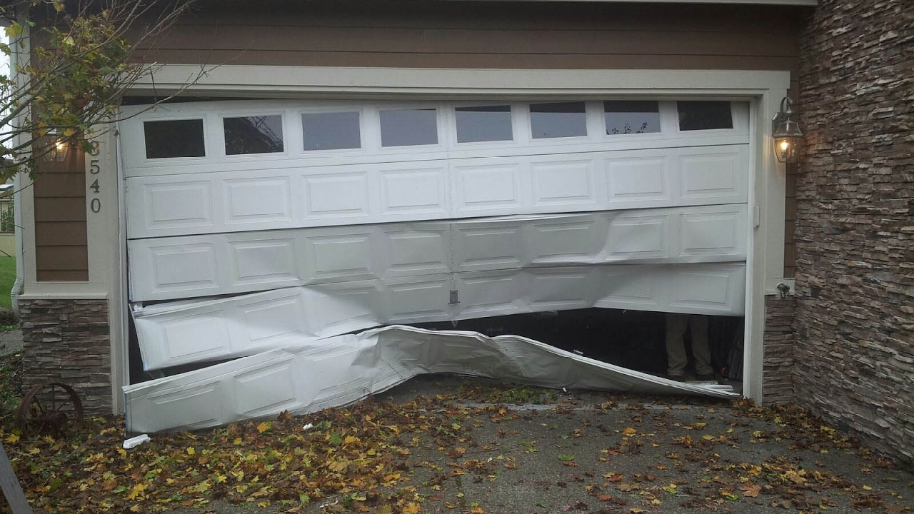 pics Smashed Garage Door i backed into the garage door now